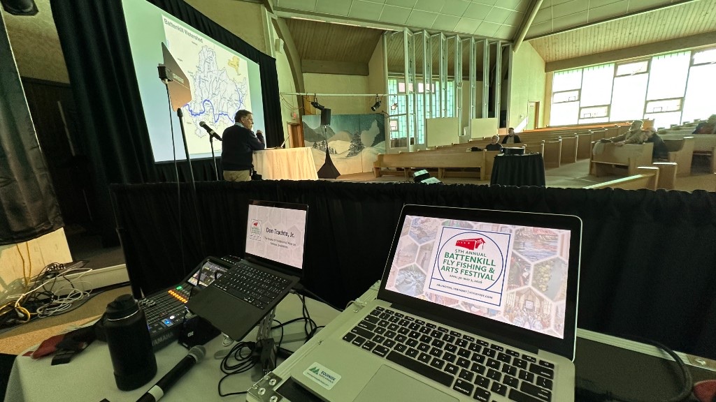 The tech table at the fifth Battenkill festival, with the watershed map on the big screen.