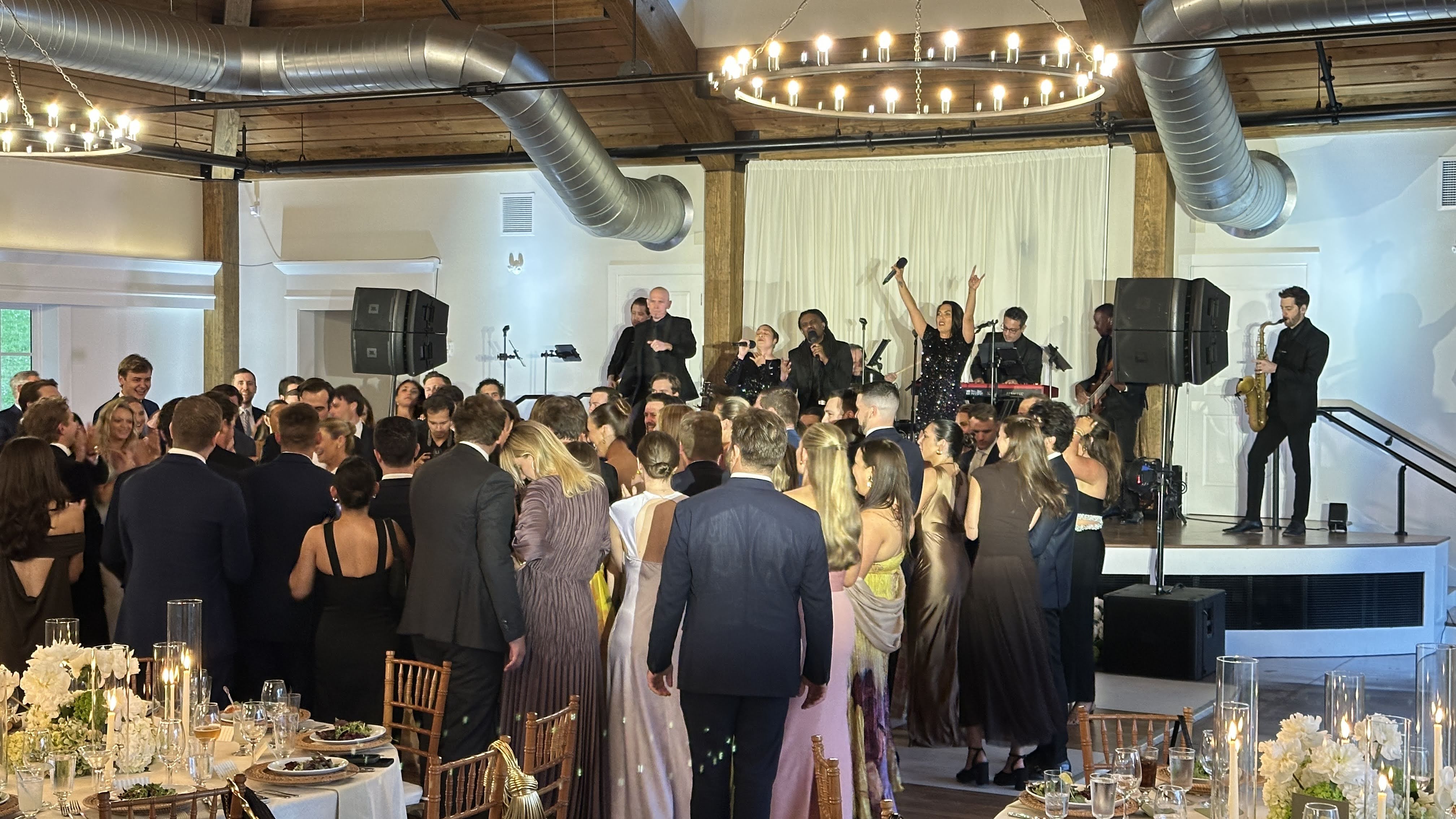 A private wedding at Hildene's Lincoln Hall with warm atmospheric lighting, Summer 2025.