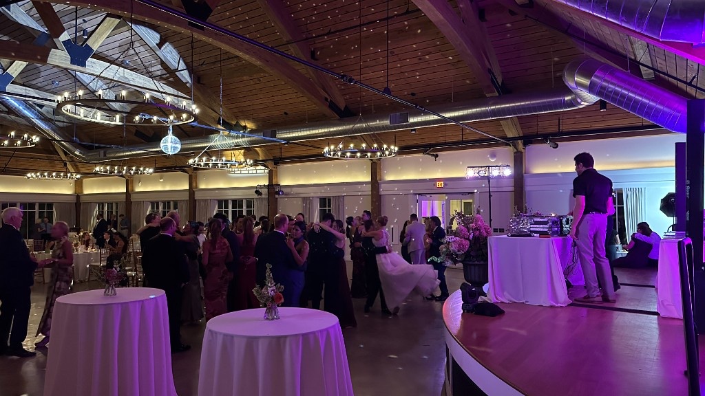Lincoln Hall during the reception, mirror ball overhead and PAR lights moving with the set.