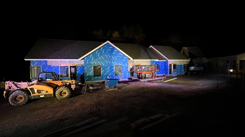 The new wing under construction at night, lit so guests could see the progress.