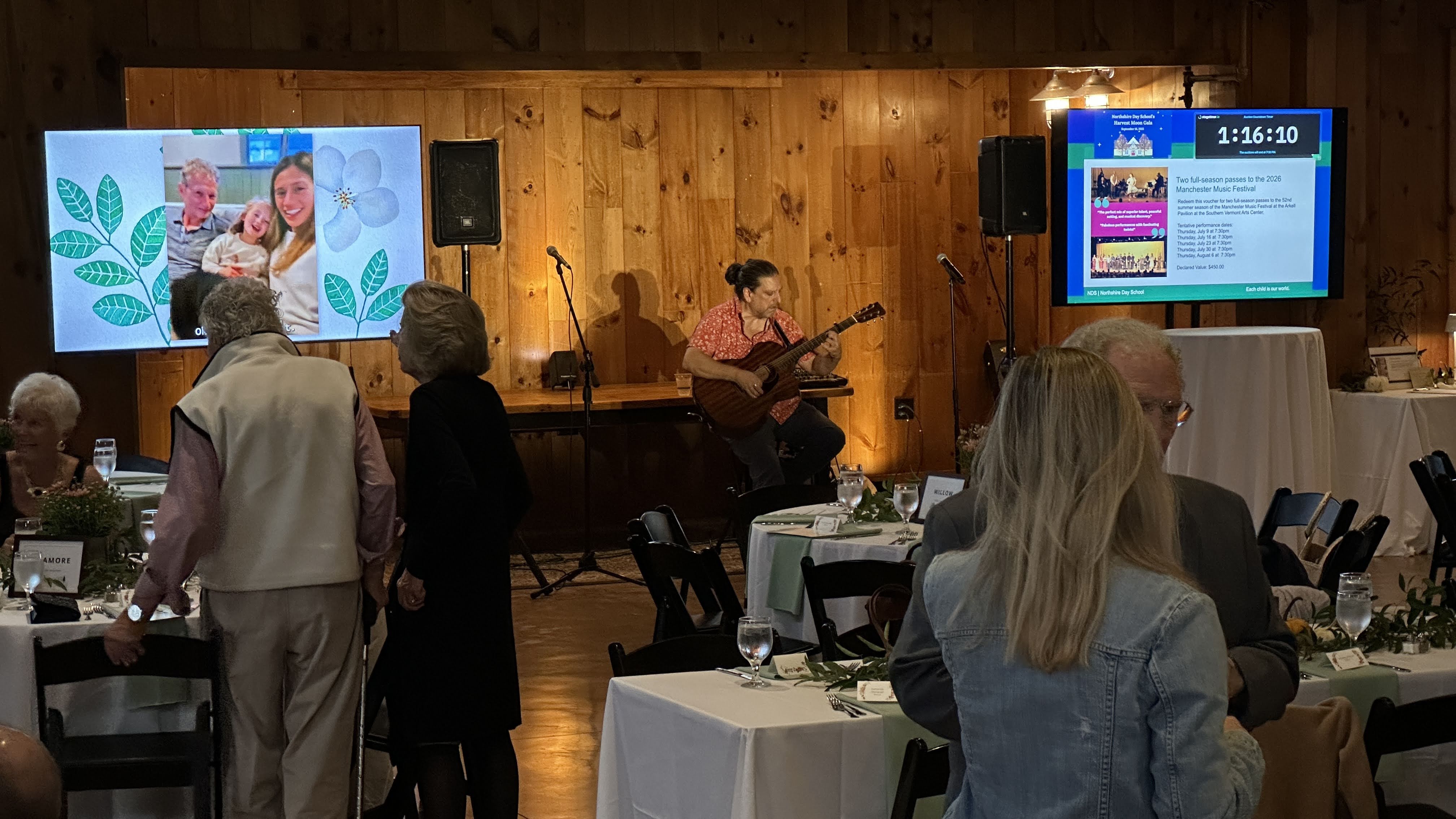 Silent auction with countdown monitors and professional event production.